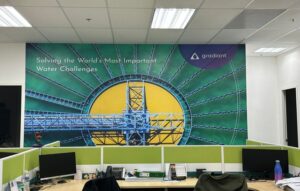 Office wall graphic for Gradiant Singapore showing branded industrial mural