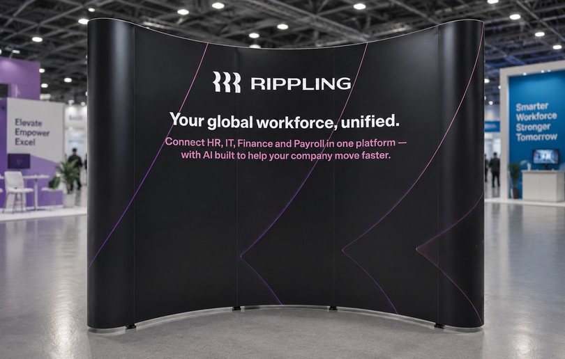 Curved pop-up exhibition backdrop featuring Rippling branding with premium large-format fabric graphics for trade shows and corporate events in Singapore.